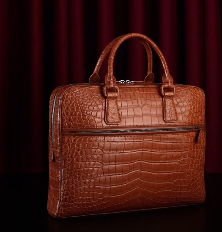 Why is the alligator leather briefcase more expensive than the cowhide briefcase