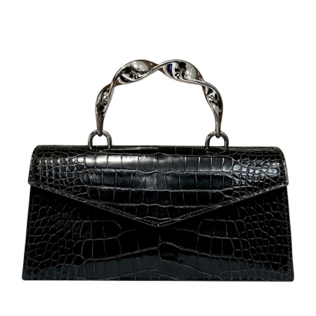 Black crocodile-embossed handbag with a twisted silver handle and envelope-style flap