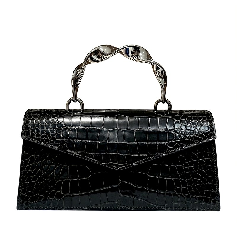 Black crocodile-embossed handbag with a twisted silver handle and envelope-style flap