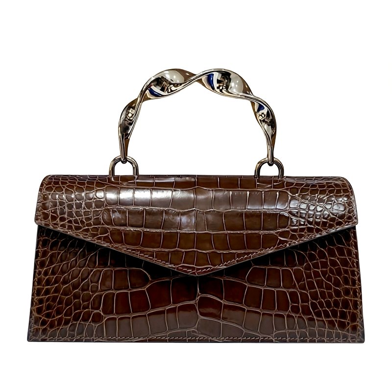 Brown crocodile-embossed leather handbag with a silver twisted metal handle.